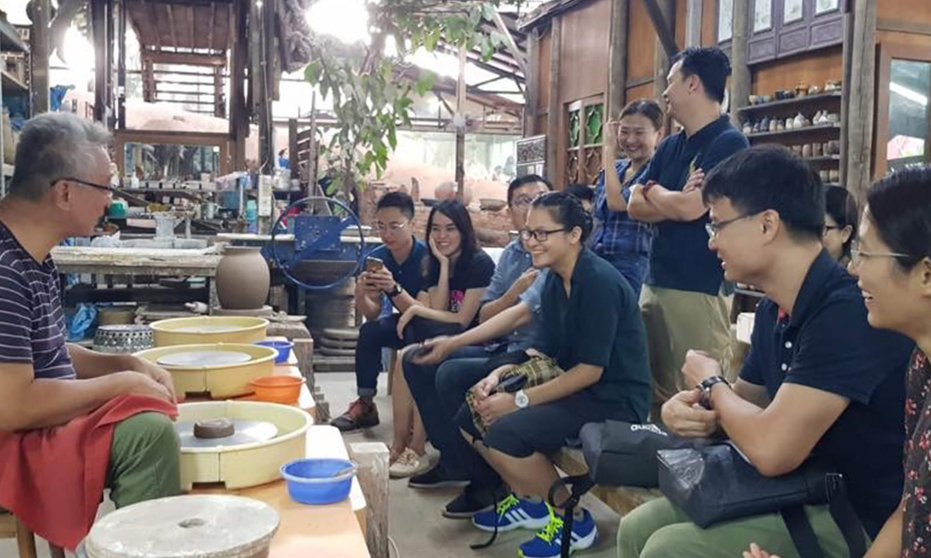 A group of people at a pottery class