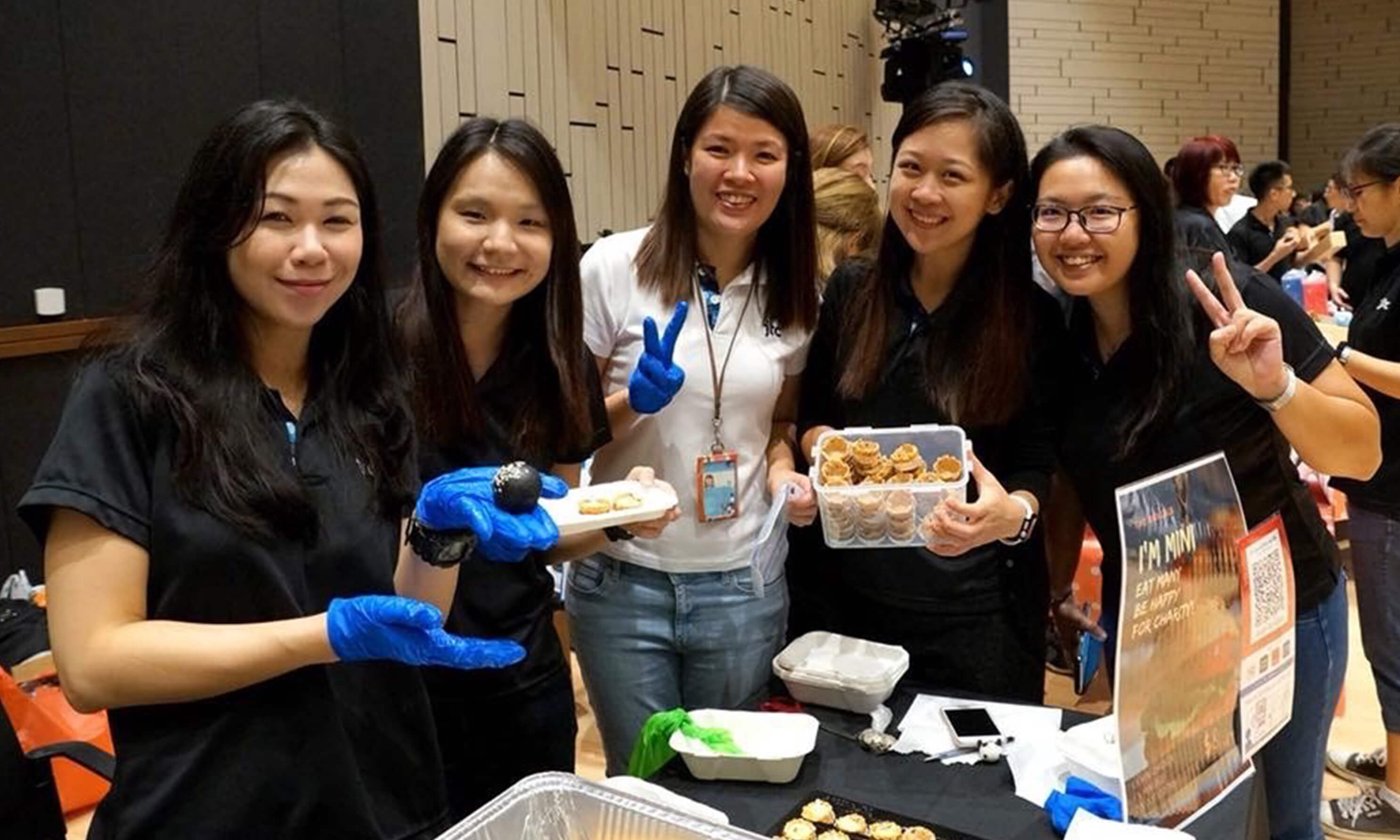 A team poses with baked goods 