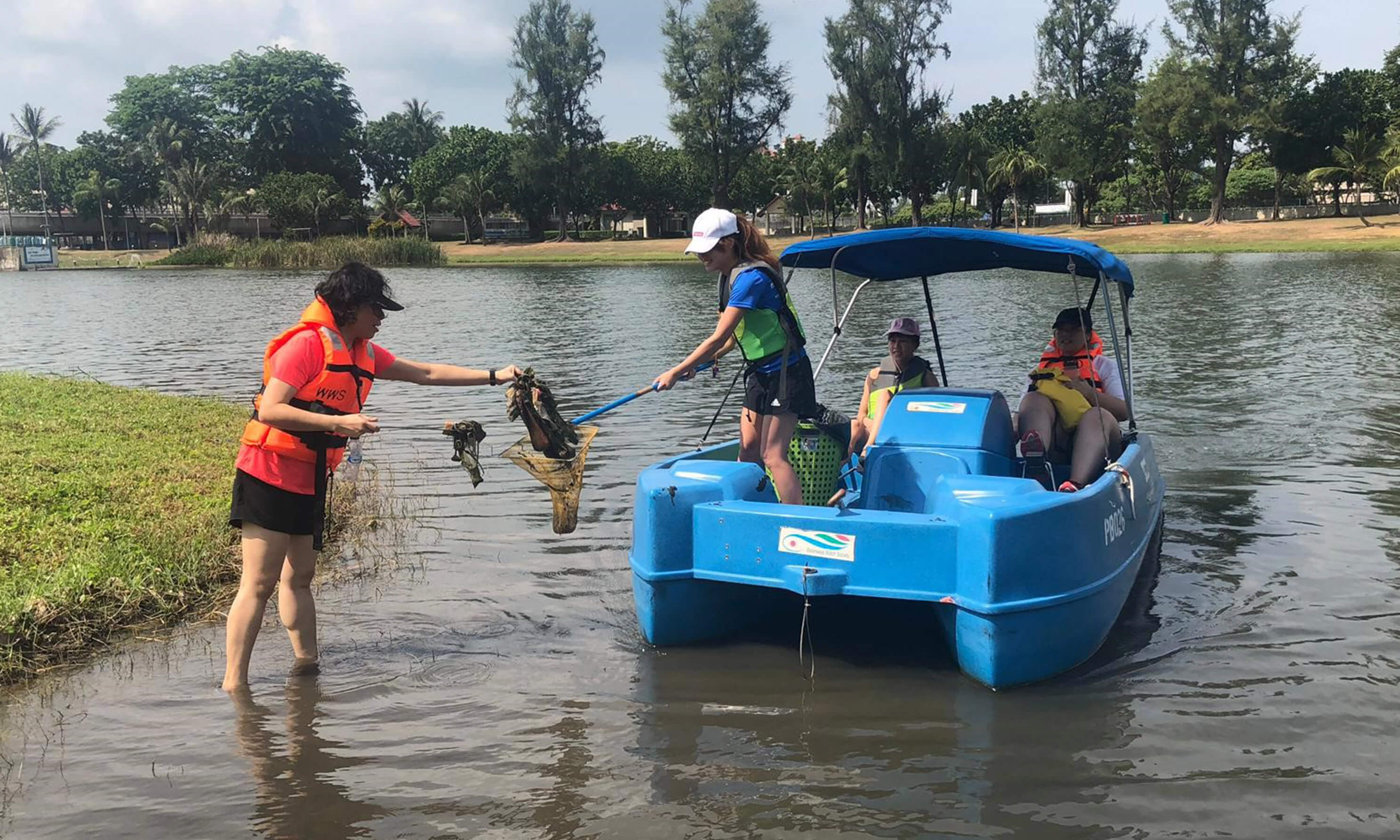 A team taking part in a river clean-up in Singapore