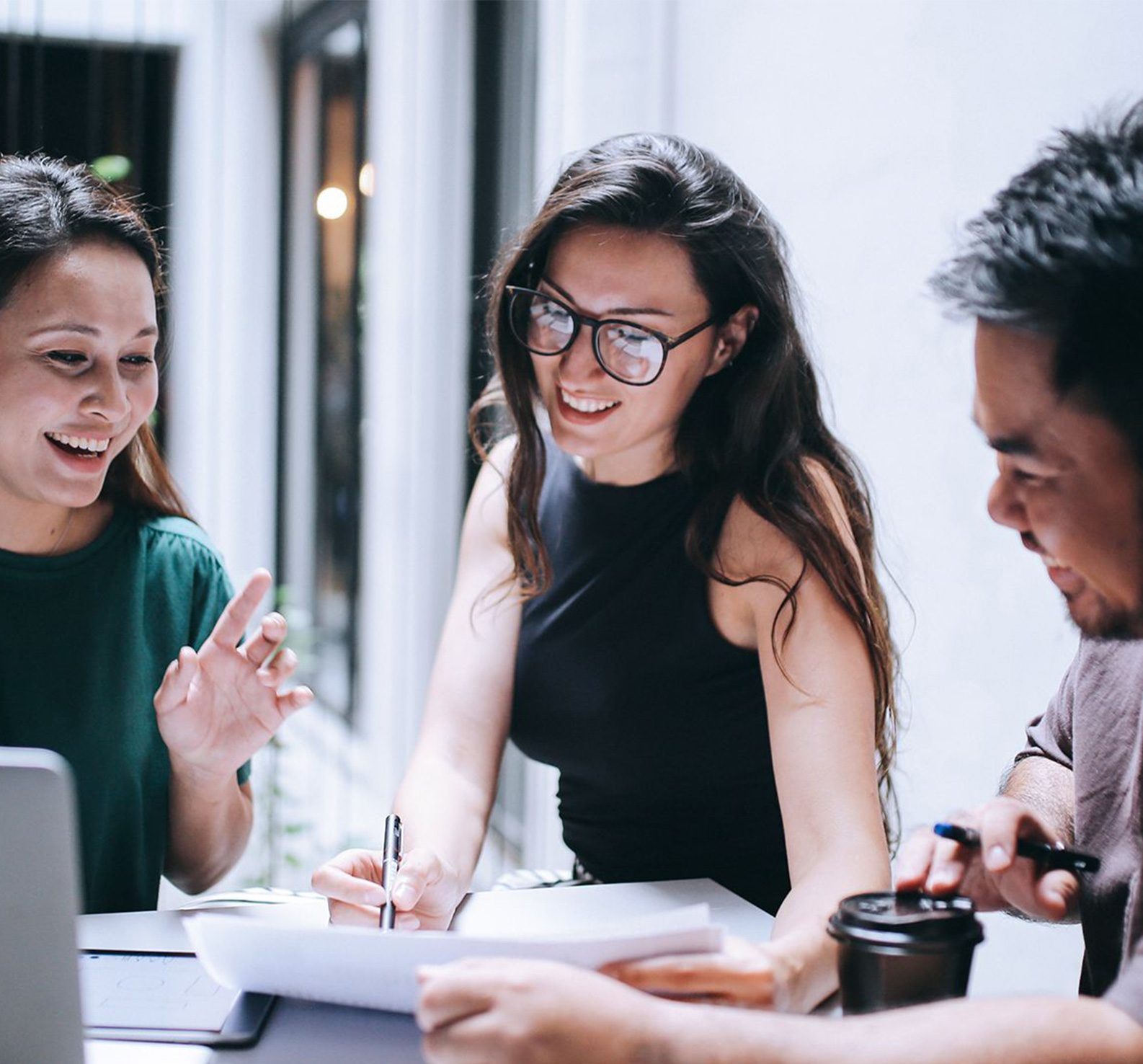 Three professionals in a meeting