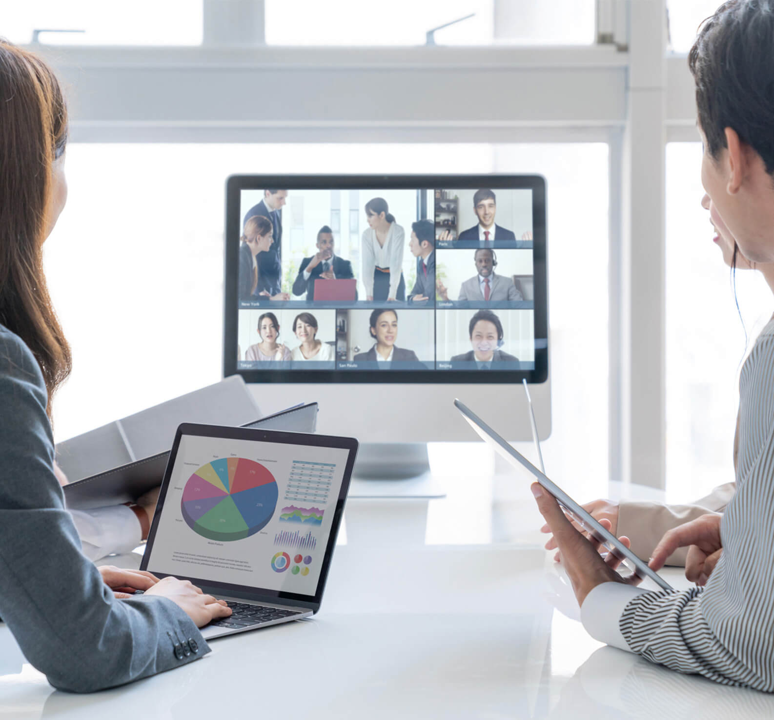 Employees in a video call with their team