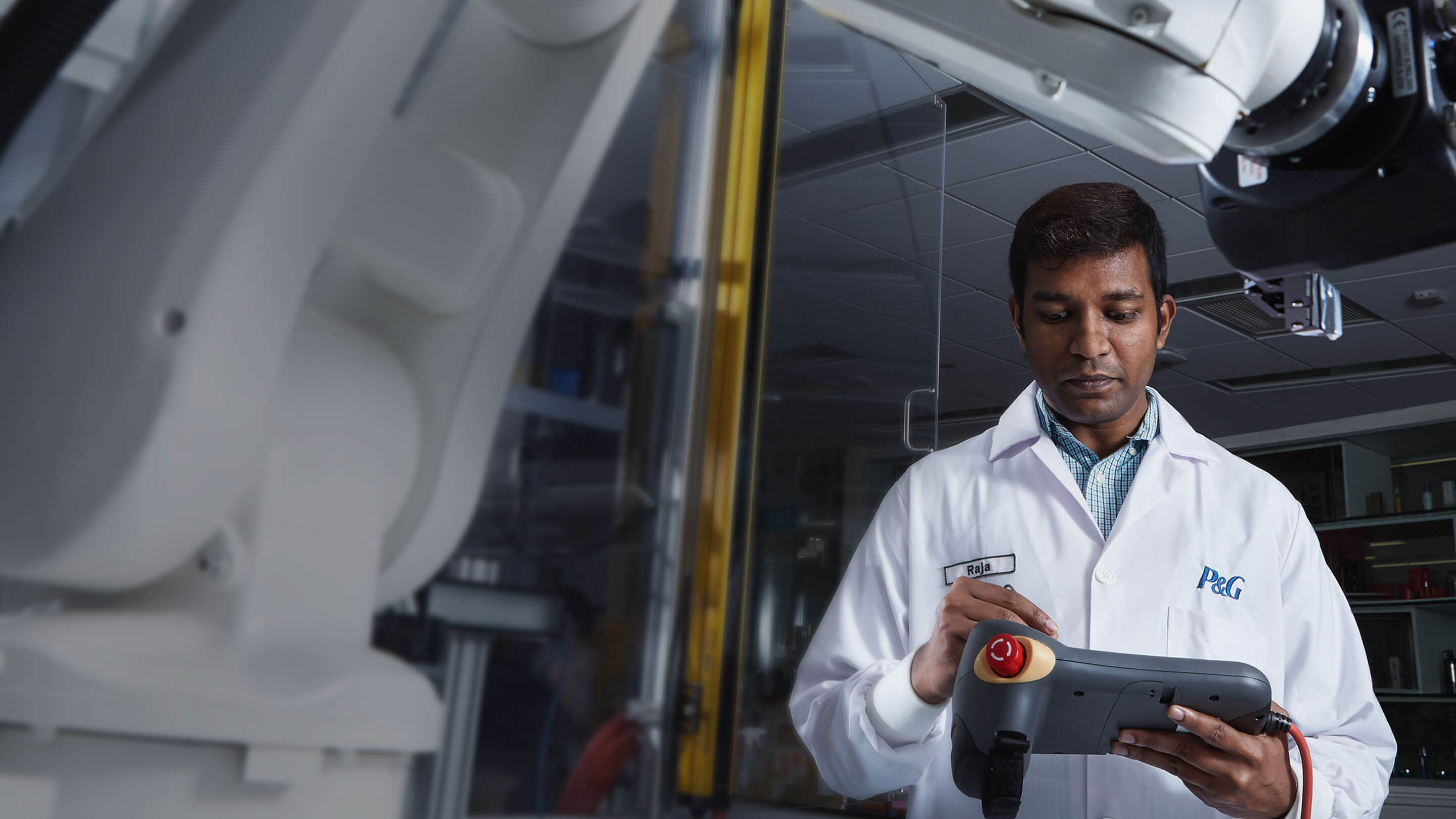 An employee from P&G conducts tests on an equipment