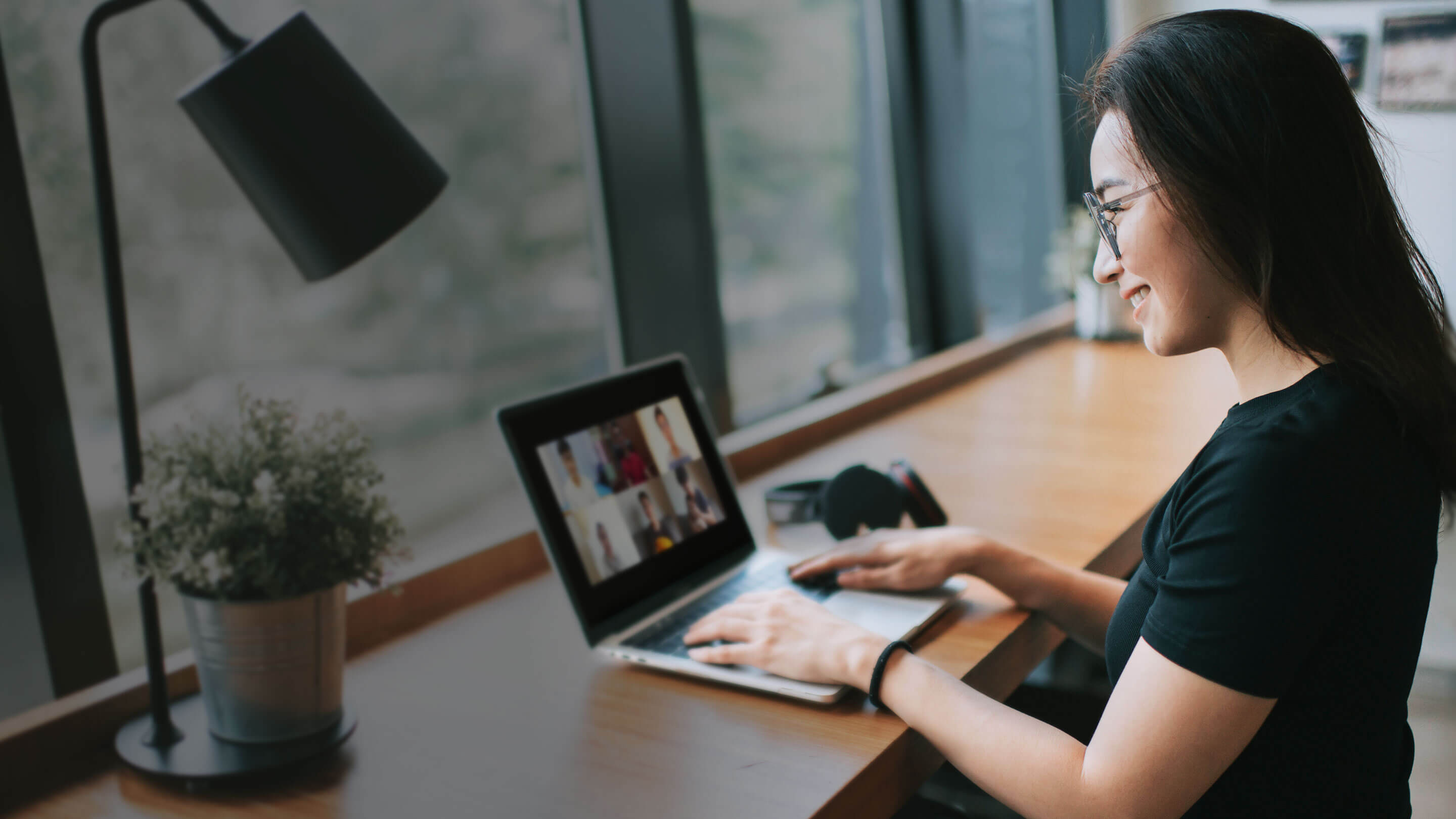 An employee having an video conference call with her team