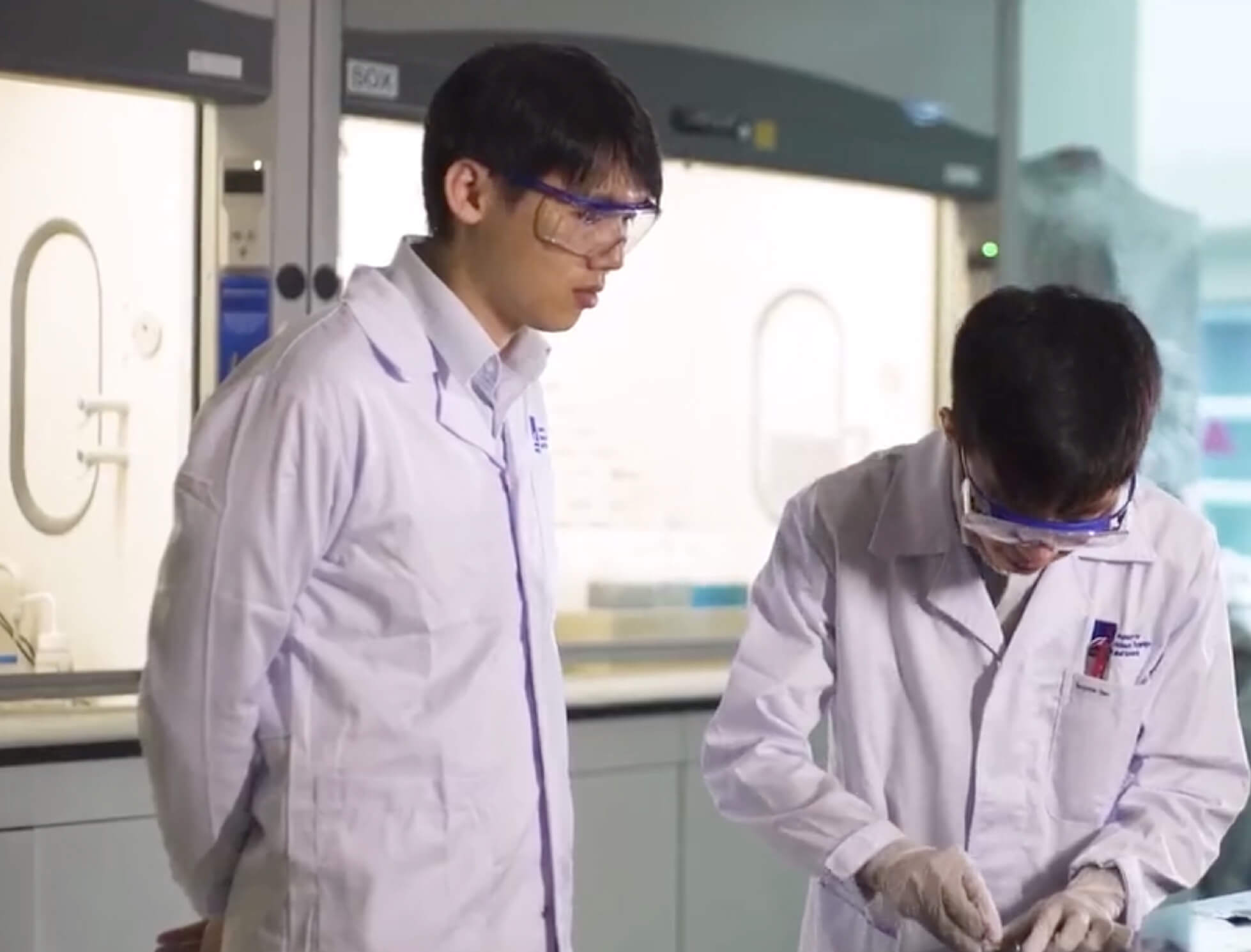 Two lab technicians conducting testing