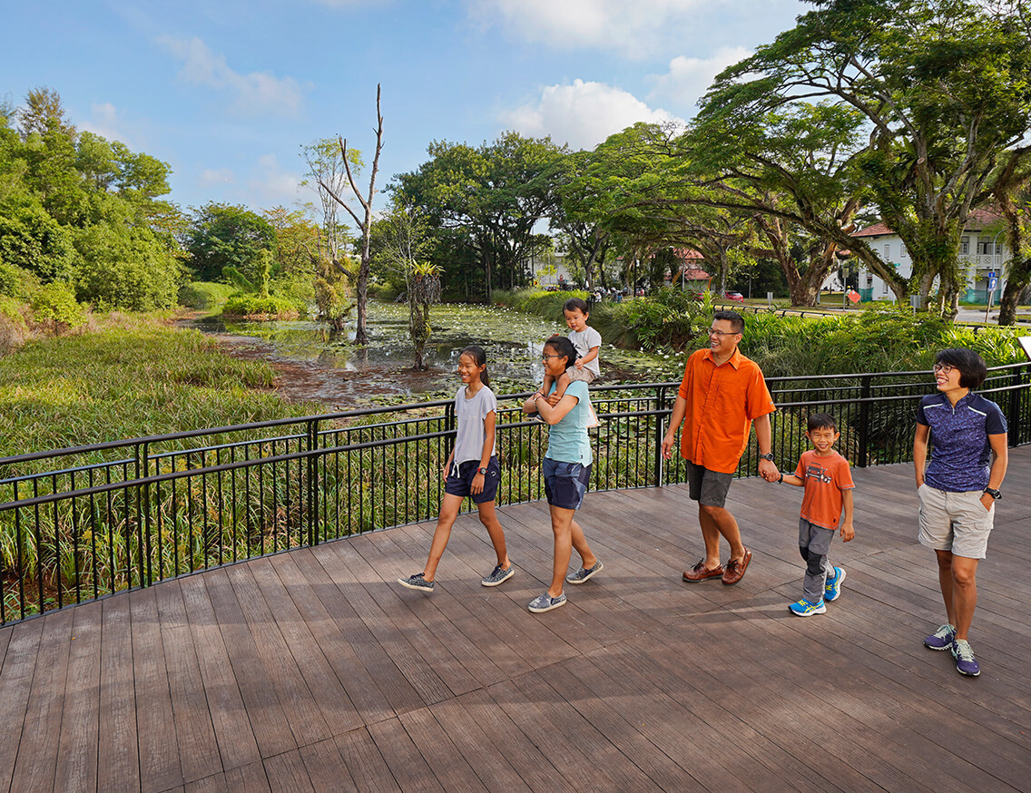 A family takes a stroll in a park