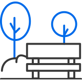 Park bench and tree icon to represent lush greenery