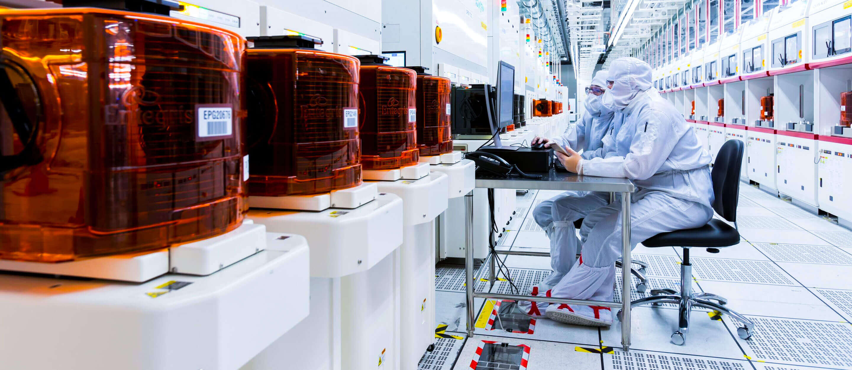 Two employees in an industrial facility