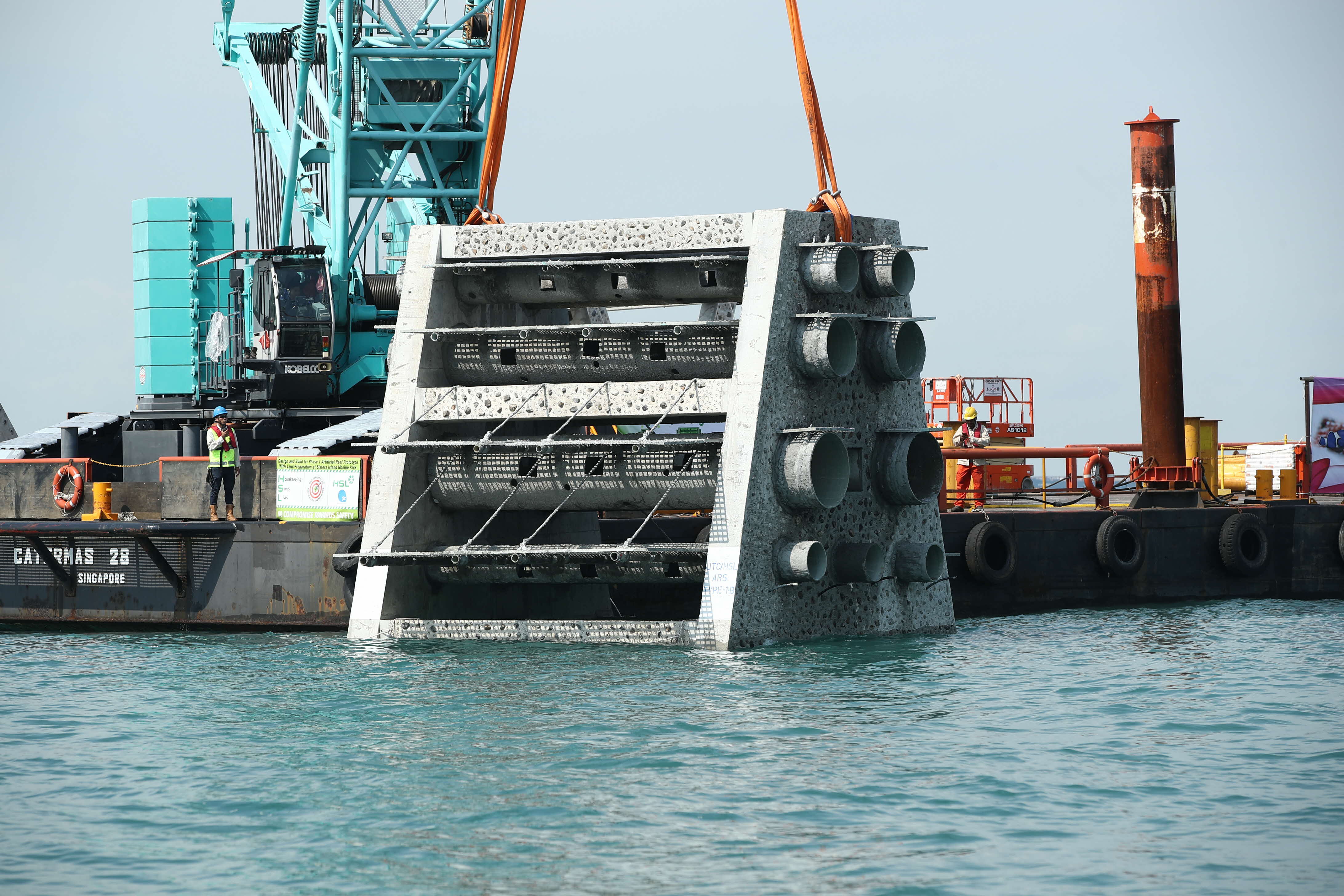 JTC artificial reef structure being submerged at Sister’s Island 