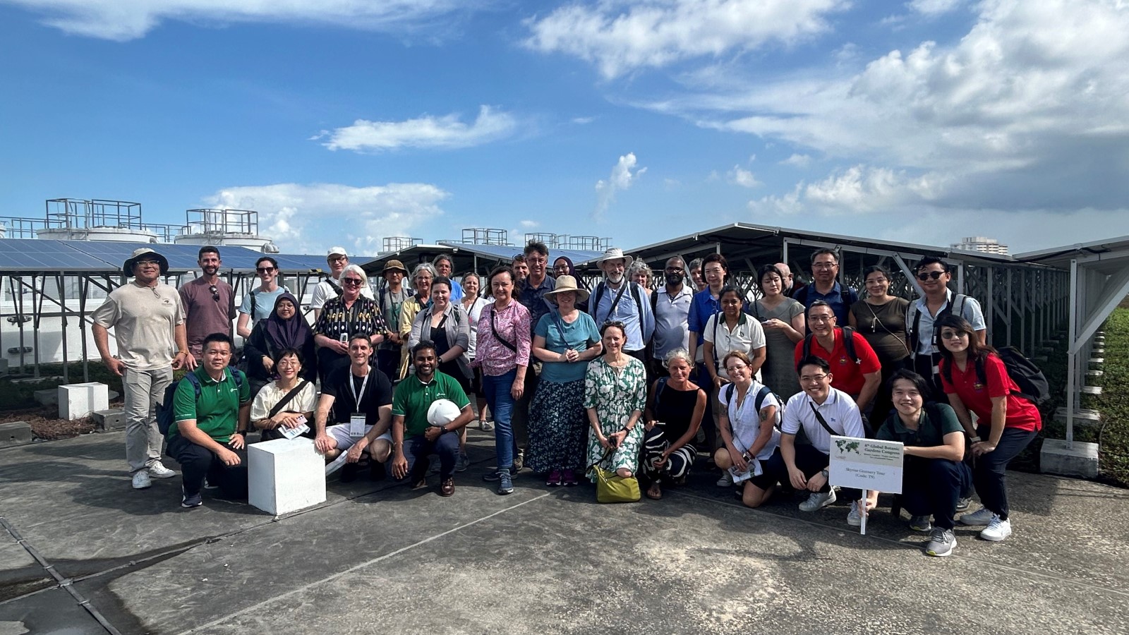 A group of visitors after a tour to experience SolarRoof firsthand.