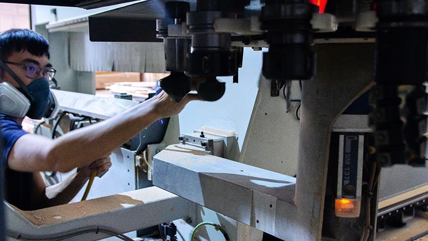 Employee at Superstructure working on timber An employee at Superstructure operating a 3D printer