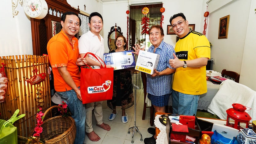 Kenny Teo helping residents of rental flats with home improvements during the WeCare Service Weeks