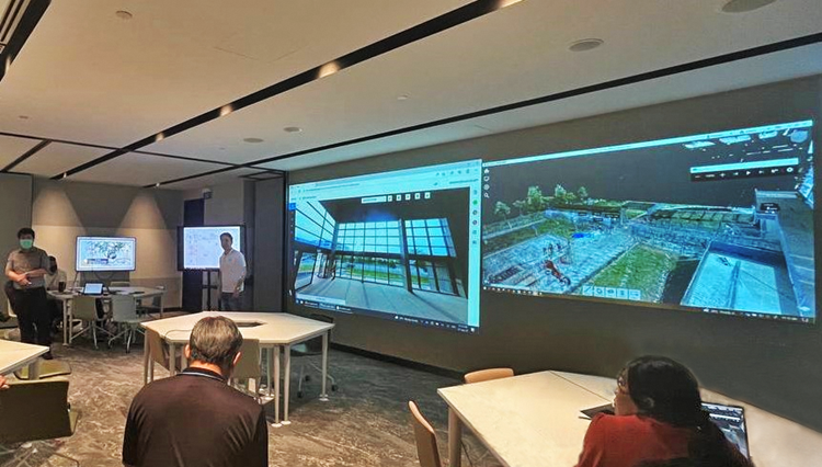 The virtual TOP inspection session in progress at JTC semiconSpace with screen (left) showing a 360-degree photo of the building and screen (right) showing its point cloud data.