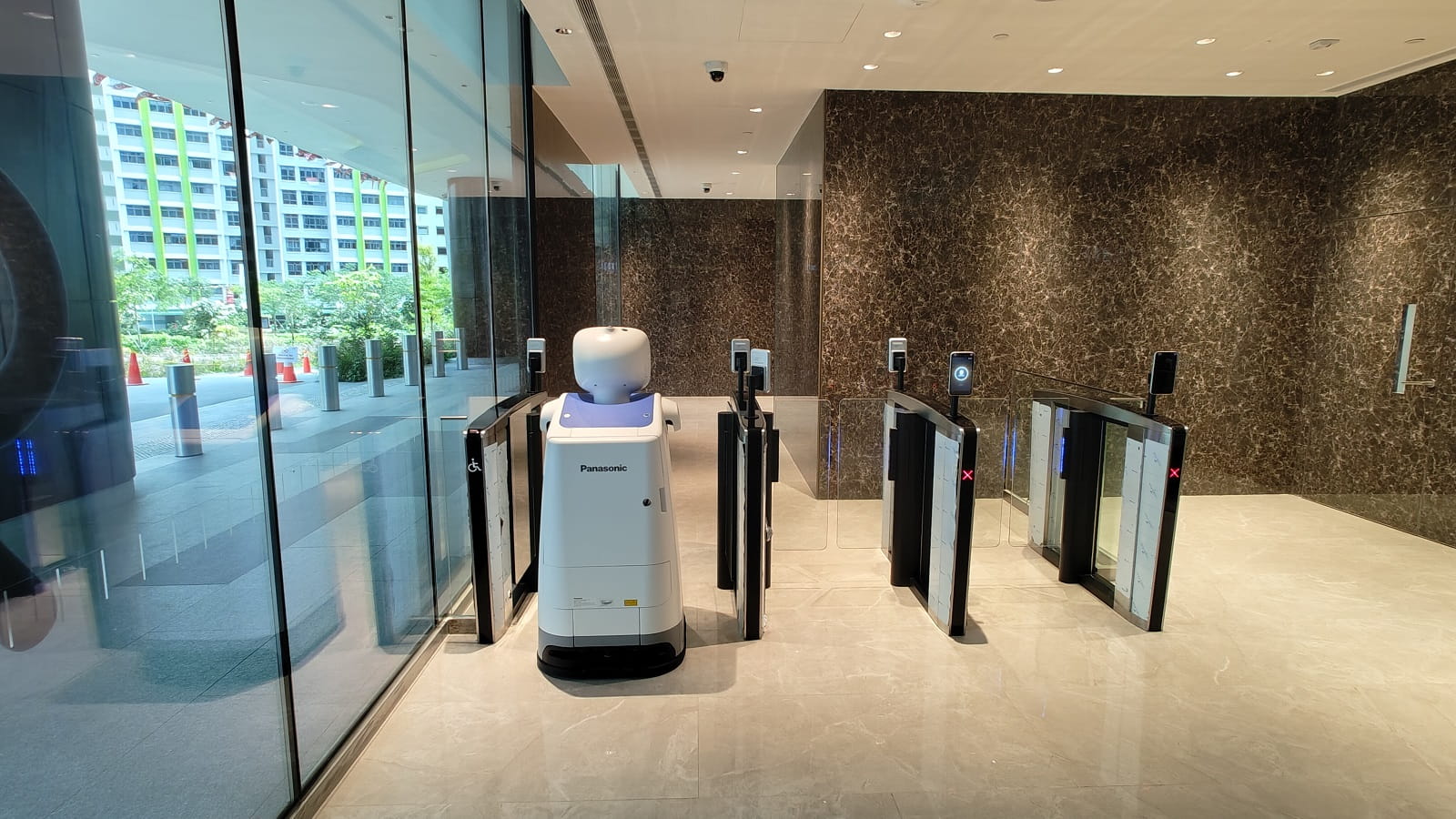 Panasonic robot navigating through a secured access gate in Punggol Digital District