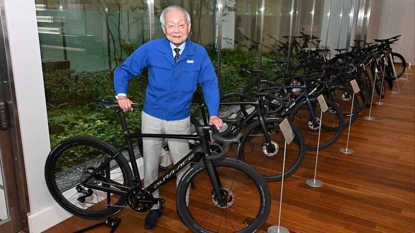 Shimano with a road bike equipped with the company's flagship component set, Dura-Ace.