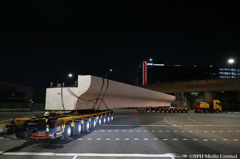 A beam being transported to a site in Jurong West, where it will be installed as part of a pedestrian overhead bridge