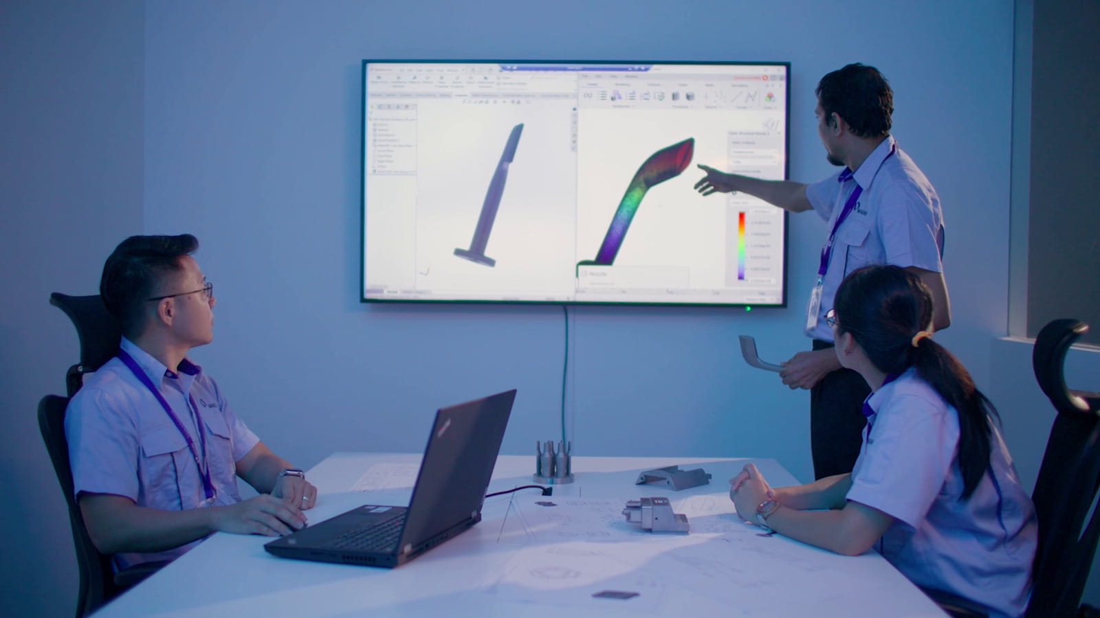 A man and a woman sitting at a table using a laptop computer Machine tool manufacturers Makino Asia offers 3D printing technology for industrial production at Jurong Innovation District