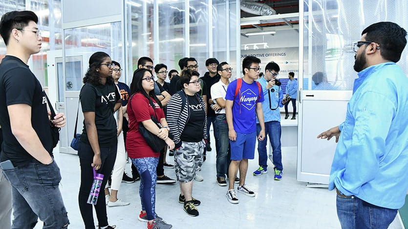 Students visiting smart factory Students tour the smart factory of an electronics company