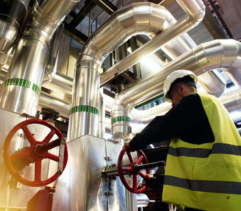 Chemical engineer fixing the pipes
