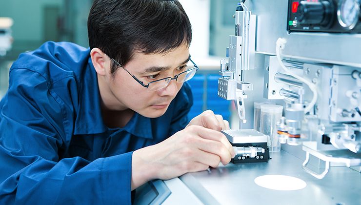 A researcher conducts experiments in a lab